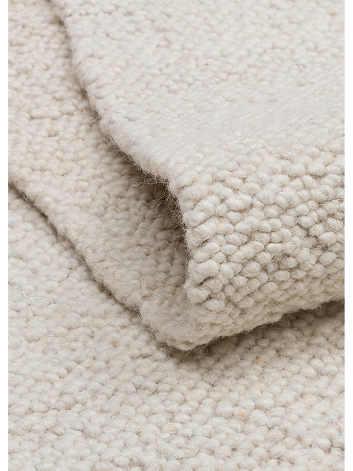 Tapis fait main en mélange de laine, polyester et coton de la série Agra IVOIRE